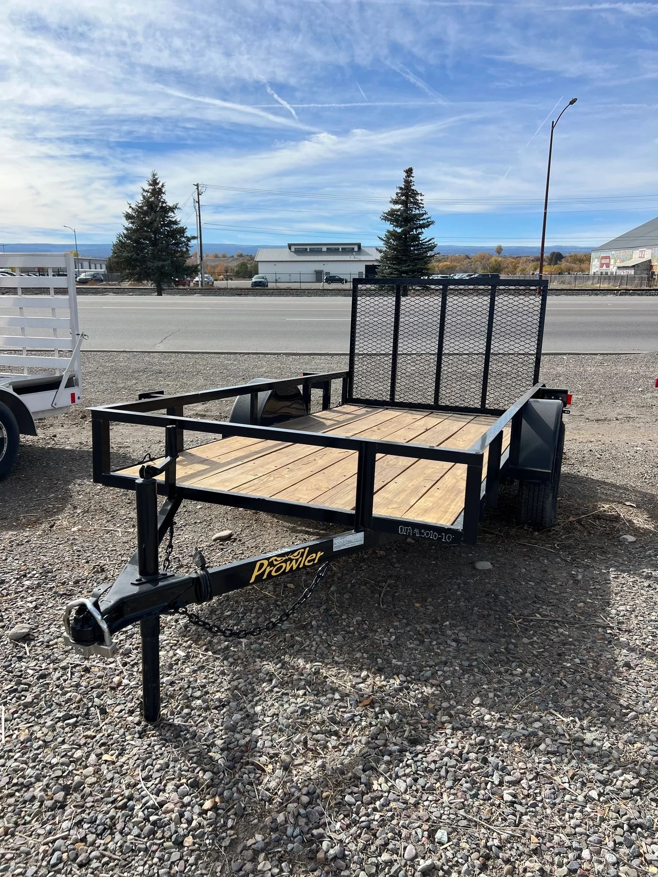 Utility trailer with a ramp gate on the lot at Big Country Trailers and Toppers in Montrose, CO